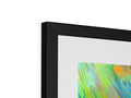 An image of an abstract painting sitting in a green frame on a flat panel.