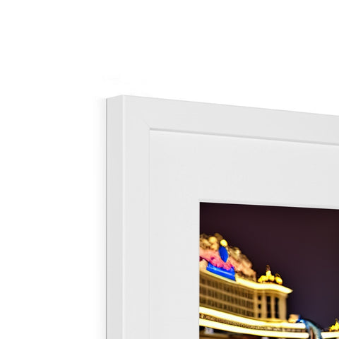 Two different colored picture frames are on top of two small rectangular display screens and wires.