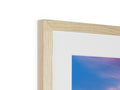 A white photo in a picture frame standing next to a wood frame.