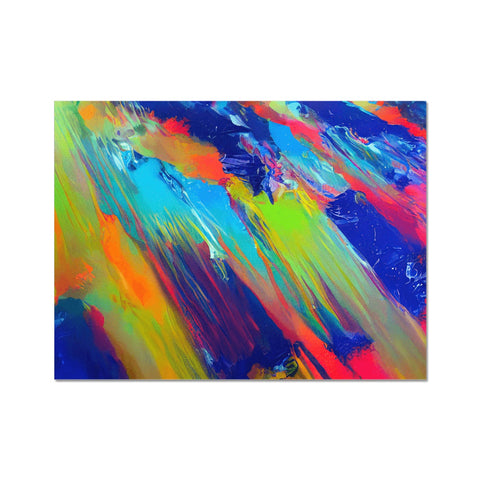 An art print with a variety of colors on it being in the air on a black