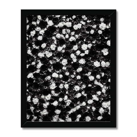 Art print of black and white photographs on top of a white counterTop.