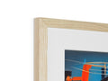 A colorful wooden frame holding a picture sitting on top of a table.