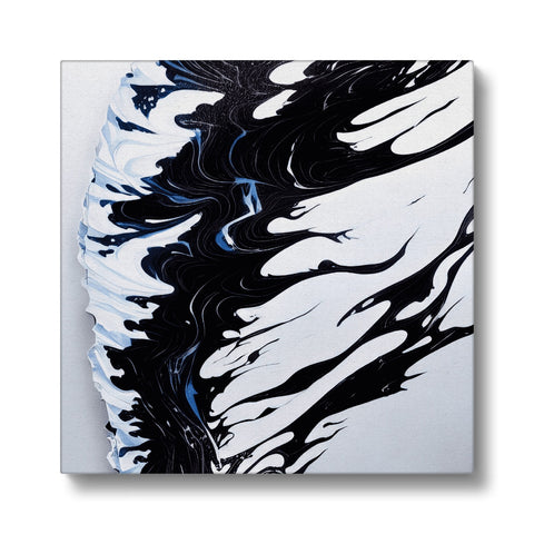 A black and white painting on ceramic tile sits in front of waves.