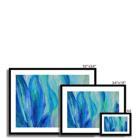 A picture frame showing green, white and blue art prints