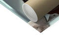 A white paper roll containing a toilet tissue dispenser sitting on top of a table.