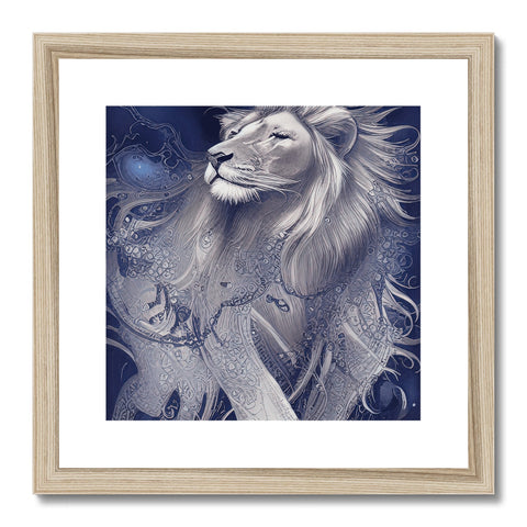 A silver framed print of the lion sitting on a table next to a white paper cutting