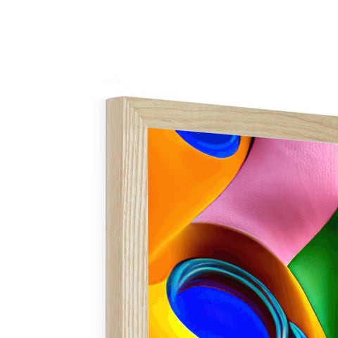 A framed picture of an abstract painting sitting on a wooden shelf.