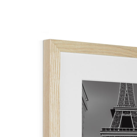 A picture frame of a wooden frame that has a black and white photo with a green