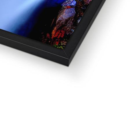 A colorful image of a picture frame with a large computer on one side.