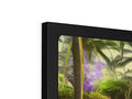 A large white flat panel display tv in a picture frame sitting on a wall.