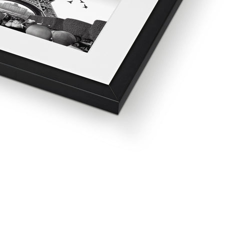 A close up of a black and white photo in the frame of a picture frame.