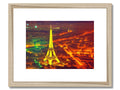 a silver photo of a Parisian eiffel tower with a frame of colored wood