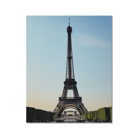 A large print of the Eiffel Tower and an old french greeting card on a