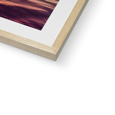 A picture of a picture frame on a red wood countertop.
