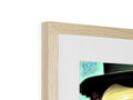An image of wood framed artwork with a picture sitting on top of it