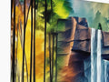 A softcover color painting on a desk with a waterfall on top.