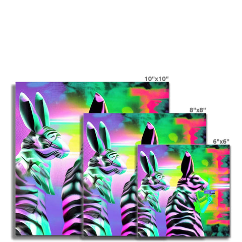 two zebras are looking in the grass at an art print on a wall.