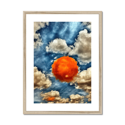 A orange colored framed painting of a cloud sitting on a wall.