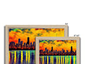 Three pictures of the Chicago skyline on a wooden framed picture frame on a wall.