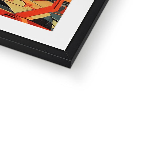 Art print in a frame on black leather on a desk with a photograph frame at the