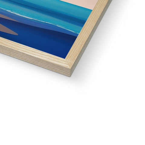 A wood frame for a sailboard on a beach with a sail in blue water.