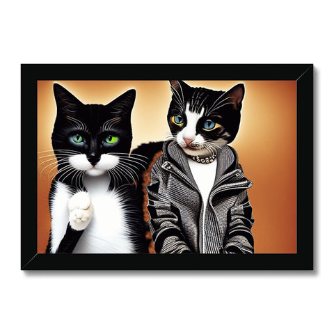 A picture frame on a white background with two cats standing on top of it.