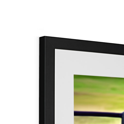 a close up of a picture frame of a flat panel TV with light and picture.