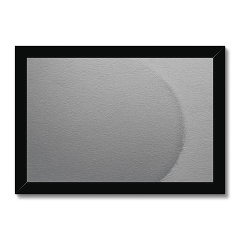 A white and black oval pinhole picture of a white wall in a small room.
