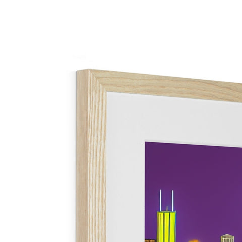 A small picture frame made of wood that has a tall view of a city skyline on