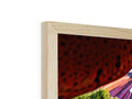 A picture frame of a girl standing underneath a picture frame that is framed in wood.
