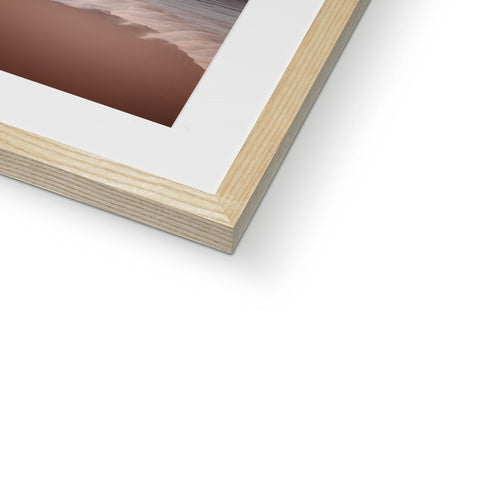 A photograph of a tree is on a wooden frame that is in a picture frame.