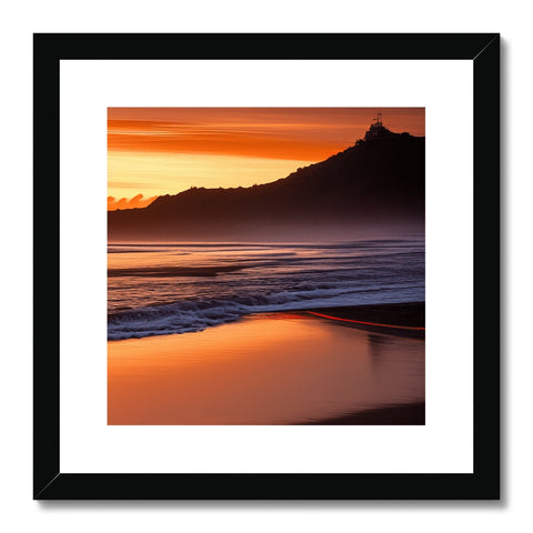 Several pictures on a wall with a framed art print of a golden sunset with a beach