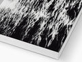 A picture of an  art book on a black and white background.