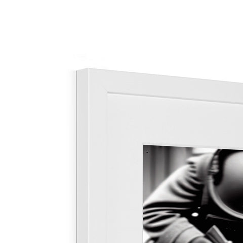 A black and white photo frames sitting on a tabletop on a flat screen TV.