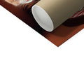 Paper towel roll with white paper inside of toilet paper bag and some wrapping paper in