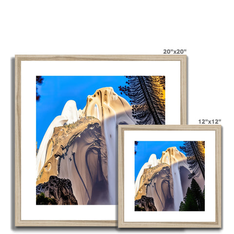 Wooden picture frames with a mountain and a tree in the background of an image on