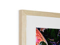 a picture frame on a table with a close up of a wood frame with photo on