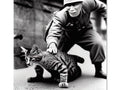 A male soldier stands next to a cat scratching at its shoulder.