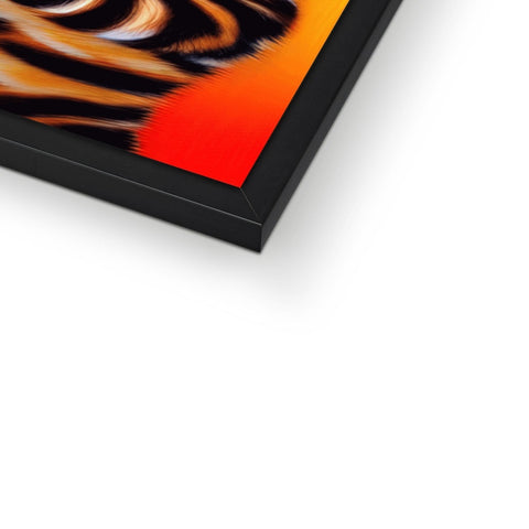 A picture frame containing a flame painting of a tortoise shell on a table in front