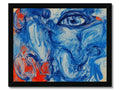 A woman behind a blue art print with a red nose and mouth.