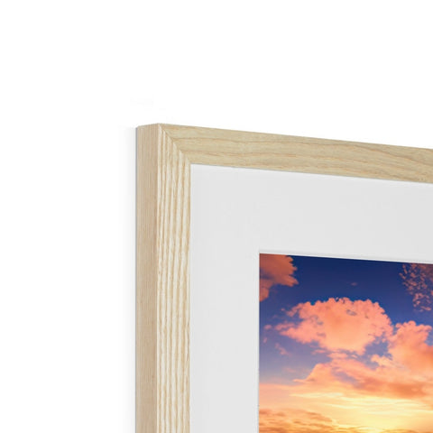 A photo frame framed in wood with photo above it