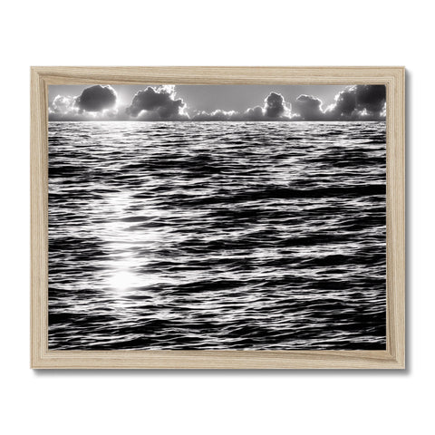 A picture of the ocean on a small metal framed art print.
