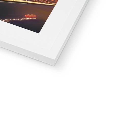 A close up of a double shot of a white picture frame containing a picture frame.