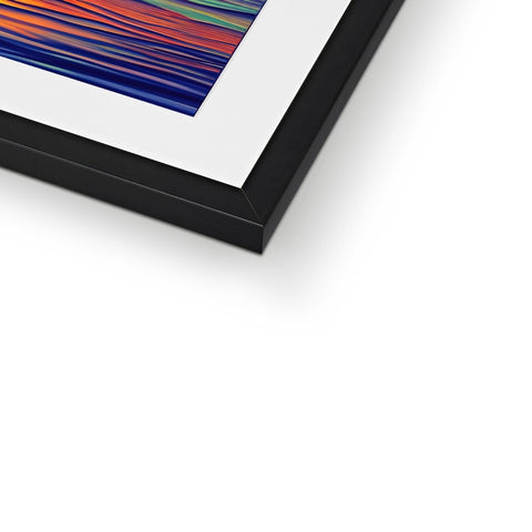 A picture frame of an art print sits on top of a display board.