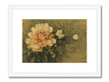 A green and gold framed art print featuring an  image of a flower.