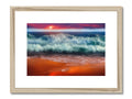 A picture of a beach at sunset framed in wood