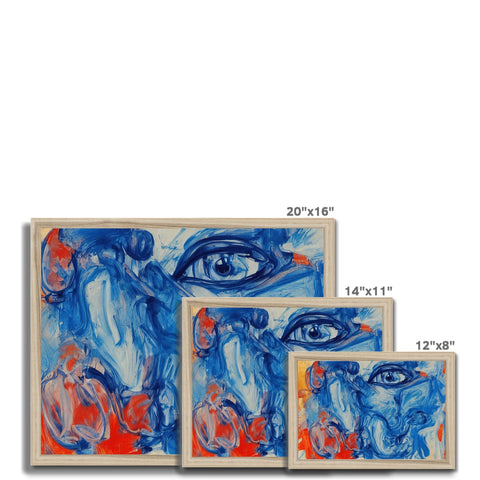 Three art prints with faces in front of a mural on a ceramic tile tile.