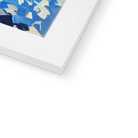 A blue and white picture frame with a bird sitting on top of it.