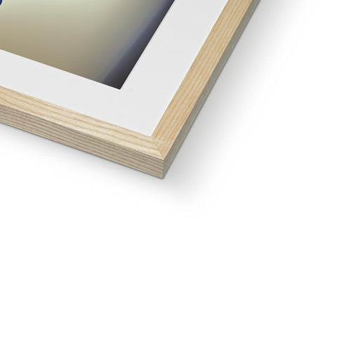 A picture of a white photo on a frame with a wood frame.