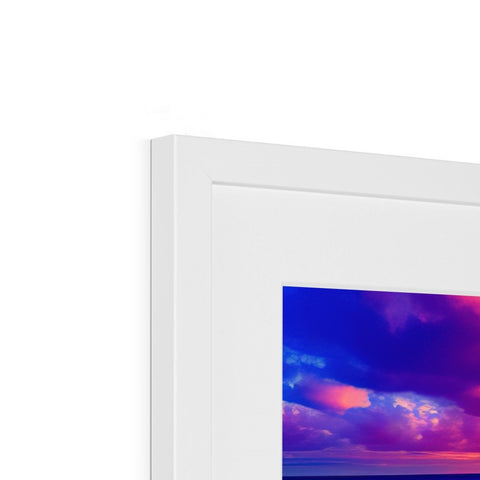 A photo frame with an imac photo sitting on top of it on a room.